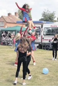  ??  ?? Hot Shots debut: The girls from Aldershot FC’s cheerleadi­ng team made their first appearance at the Frimley Green Carnival.