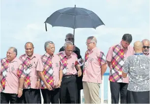  ?? AFP ?? Australian Prime Minister Scott Morrison, fourth from right, talks with other leaders at the Pacific Islands Forum in Tuvalu.