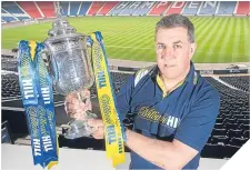  ??  ?? ■
Mark McGhee gets to grips with the Scottish Cup.