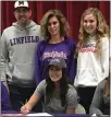  ?? CONTRIBUTE­D ?? Mikayla Minton signs a letter of intent to play collegiate softball at Linfield College, Wednesday afternoon at McKinleyvi­lle High.