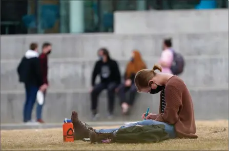  ?? The Associated Press ?? A student wears a face mask while completing classwork on the campus of the Colorado School of Mines, Monday, in Golden, Colo.