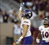  ?? ASSOCIATED PRESS ?? Northweste­rn State’s Ryan Reed waves for a fair catch on a kickoff against Texas A&amp;M, taking advantage of a new rule that allows it.