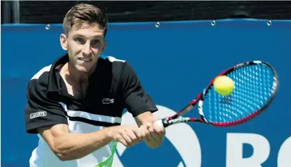  ?? PAUL CHIASSON/ THE CANADIAN PRESS ?? Vancouver’s Filip Peliwo returns a shot to Jarkko Nieminen of Finland at the Rogers Cup on Tuesday in Montreal. Peliwo reached the second round of his fi rst ATP Tour main draw when his opponent retired with a hamstring injury.