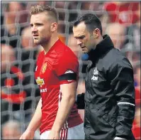  ??  ?? CROCKED: Luke Shaw is injured against Swansea