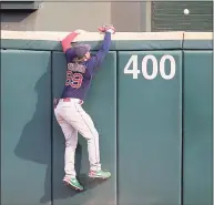  ?? Jonathan Daniel / Getty Images ?? Red Sox outfielder Alex Verdugo climbs the wall as a ball hit by Chicago’s Leury Garcia clears it in the ninth inning on Sunday in Chicago.