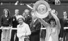  ?? Mike Stephens/Getty Images ?? The Queen looks on as Virginia Wade lifts the Wimbledon trophy in 1977. Photograph: