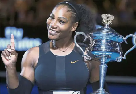  ??  ?? Wait for my return: Serena Williams holds up a finger and her trophy after defeating her sister, Venus, in the women’s singles final at the Australian Open last year.