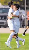  ?? JIM THOMPSON/JOURNAL ?? St. Pius’ Julian Garcia, right, embraces teammate and brother Marcus Garcia after Marcus assisted on one of Julian’s four goals.