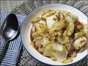  ?? PHOTOS BY ABEL URIBE / CHICAGO TRIBUNE ?? Chopped cabbage is stir-fried with chile crisp, soy sauce, vinegar, sesame oil and garlic. It works as a side dish or a main served with rice.