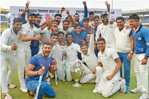  ?? PTI ?? Vidarbha celebrate with the Ranji Trophy after beating Delhi in the final by nine wickets. —