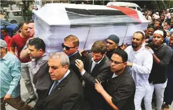  ??  ?? People carry the coffin of Palestinia­n Fadi Al Batsh to a mosque for funeral prayers in Kuala Lumpur yesterday. The body was to be taken to Gaza later yesterday via Egypt.