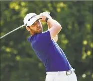  ?? Gregory Shamus / Getty Images ?? Matthew Wolff plays his shot from the 18th tee during the third round of the Rocket Mortgage Classic on Saturday at the Detroit Golf Club.