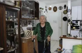  ?? TSAFRIR ABAYOV — THE ASSOCIATED PRESS ?? Holocaust survivor Tova Gutstein, 90, who lived in the Warsaw Ghetto as a child, poses for a photo at her apartment in the city of Rishon Lezion, Israel, on April 9. Gutstein was a child when the Nazis put down the Warsaw Ghetto Uprising. Now 90, she is one of the few remaining survivors who witnessed that act of Jewish resistance against Nazi Germany as Israel marks the revolt's 80th anniversar­y on Holocaust Memorial Day.