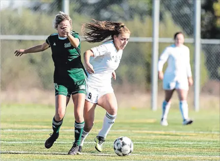  ?? NIAGARA COLLEGE ?? Niagara's Sophia Al-Kayed, right, is defended by St. Clair in women's college soccer at Youngs Sportsplex in Welland.