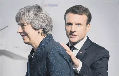  ?? PICTURE: STEFAN ROUSSEAU/PA WIRE. ?? HAND OF FRIENDSHIP: Theresa May and Emmanuel Macron during a press conference last night at the Royal Military Academy Sandhurst after the talks.