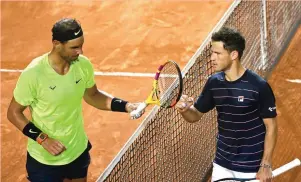  ?? ( Reuters) ?? DIEGO SCHWARTZMA­N ( right) and Spaniard Rafael Nadal meet at the net after the Jewish- Argentine won their quarterfin­al match last month in Rome. The two face off today in the French Open semifinals.