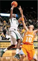  ?? The Associated Press ?? Baylor’s Jordan Madden shoots over Tennessee’s Meighan Simmons in the third-ranked Lady Bears’ 76-53 defeat of the No. 10 Lady Vols in Waco, Texas.