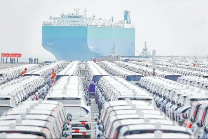  ?? Chinatopix The Associated Press ?? Vehicles for export are parked Tuesday on a dock at a port in Yantai in eastern China’s Shandong province. Chinese exports grew 8.5 percent in April.