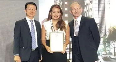  ??  ?? Livingspri­ngs Communitie­s managing director and architect Monique Albert-Lopez receives two awards on behalf of 10 Acacia Place at the 2019 Asia Pacific Property Awards.