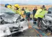  ??  ?? Emergency crews attend the headon smash near Lake Tekapo where three Chinese tourists died.