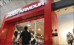  ?? JOE RAEDLE / GETTY IMAGES ?? Under Armour, a competitiv­e challenger to Nike in the sports gear market, revised its revenue expectatio­ns amid a federal investigat­ion of its accounting practices.