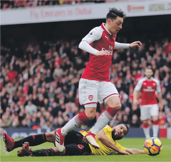  ?? Reuters ?? Arsenal’s Mesut Ozil has reached 50 assists quicker than anyone who has ever played in England’s Premier League, but arguments over his value persist