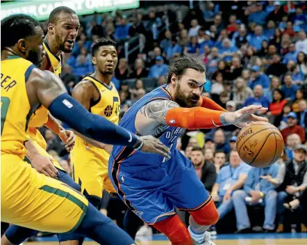  ?? AP ?? Kiwi and Thunder centre Steven Adams, right, fights for the loose ball against Utah yesterday.