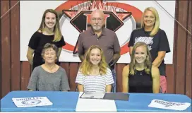  ?? Scott Herpst ?? Family and friends joined Ridgeland graduate Kaitlyn Durham (seated, center) at Hot Shots Cheerleadi­ng in Fort Oglethorpe to watch her sign on to continue her career at Shorter University. On hand for the ceremony were Gale, Lebron and Courtney Durham, along with Ridgeland head cheer coach Abby Bates and Mindy Poindexter of Hot Shots.