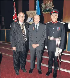  ??  ?? Jack Burgess, centre, at his BEM ceremony with Fife Provost Jim Leishman, left, and Lord Lieutenant of Fife Robert Balfour.