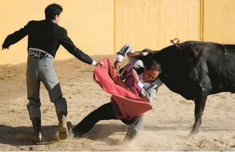  ?? FERNANDO VERGARA/AP ?? Matador Jelain Fresneda is gored during a bullfight Feb. 25 at the Hacienda Vista Hermosa bullring in Villapinzo­n, Colombia.
