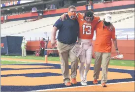  ?? DENNIS NETT — THE POST-STANDARD VIA THE ASSOCIATED PRESS ?? Syracuse quarterbac­k Tommy DeVito is carried off the field in the second half of the team’s 38-24loss to Duke on Saturday, Oct 10, at the Carrier Dome in Syracuse.