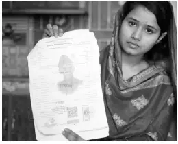  ?? AP ?? In this April 14, 2019 photo, Mahek Liaqat, who married a Chinese national, shows her marriage certificat­e in Gujranwala, Pakistan.