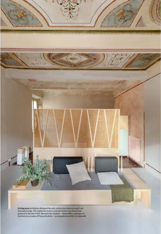  ??  ?? Living area Archiplan designed the sofa, which also features a pull-out bed and storage. The highly decorative ceiling is believed to have been painted in the late 1700s. Beneath the window – which offers a glimpse of the historic arcades of Piazza Broletto – is a bespoke bench by Archiplan