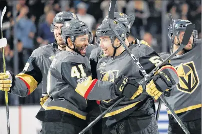  ?? AP PHOTO/JOHN LOCHER ?? The Vegas Golden Knights’ Pierre-Edouard Bellemare, left, celebrates with David Perron after Perron made the game-winning goal in overtime of an NHL hockey game against the Buffalo Sabres on Tuesday in Las Vegas.