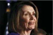  ?? JACQUELYN MARTIN — THE ASSOCIATED PRESS ?? House Minority Leader Nancy Pelosi of Calif., speaks about Democratic gains in the House of Representa­tives to a crowd of Democratic supporters during an election night returns event at the Hyatt Regency Hotel, on Tuesday in Washington.