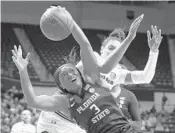  ?? JASON E. MICZEK/AP ?? Florida State guard Sayawni Lassiter battles for the ball with South Carolina’s Alexis Jennings during the second round of the women’s NCAA Tournament on Sunday.