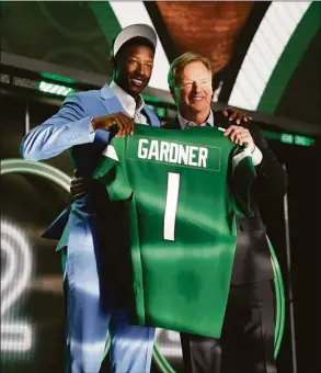  ?? John Locher / Associated Press ?? Cincinnati cornerback Ahmad Gardner, left, stands with NFL Commission­er Roger Goodell after being picked by the New York Jets with the fourth pick of the NFL football draft Thursday in Las Vegas.