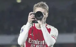  ?? ?? Martin Odegaard enjoying the aftermath of the win over Liverpool