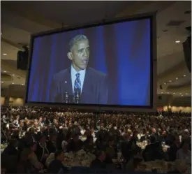  ?? EVAN VUCCI — THE ASSOCIATED PRESS ?? Audience members look on as President Barack Obama speaks during the National Prayer Breakfast in Washington on Thursday. The president condemned those who seek to use religion as a rationale for carrying out violence around the world, declaring...