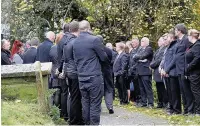  ??  ?? ●● Mourners included family, friends and former colleagues