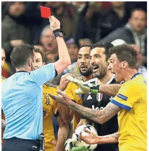  ?? — AP ?? Out you go: Referee Michael Oliver showing the red card to Juventus goalkeeper Gianluigi Buffon.