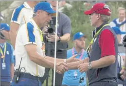  ?? CHARLIE NEIBERGALL — THE ASSOCIATED PRESS ?? Team USA captain Steve Stricker shakes hands with Team Europe captain Padraig Harrington after the Ryder Cup matches at the Whistling Straits Golf Course on Sunday in Sheboygan, Wis.