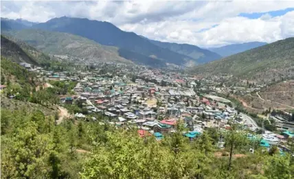  ??  ?? The capital city of Thimphu with a population of about 115,000 is nestled in the mountains of Bhutan.