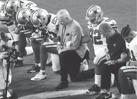  ?? MATT YORK/THE ASSOCIATED PRESS FILES ?? The Dallas Cowboys, led by owner Jerry Jones, take a knee before the U.S. national anthem before a game last season.