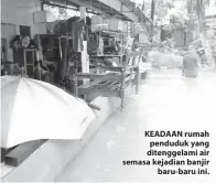  ??  ?? KEADAAN rumah penduduk yang ditenggela­mi air semasa kejadian banjir baru-baru ini.