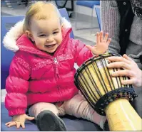  ?? DESIREE ANSTEY/JOURNAL PIONEER ?? Stephanie Sheppard brought her 15-month-old daughter, Lucy, to celebrate the important role drums played in the preservati­on of African rhythmic heritage at Summerside Rotary Library last weekend.