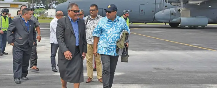  ?? Photo: DEPTFO News ?? Prime Minister Voreqe Bainimaram­a (right), flew into Tuvalu on board a Royal Australian Air Force aircraft. He is being received by Tuvalu’s Foreign Minister Taukelina Finikaso on August 11, 2019.