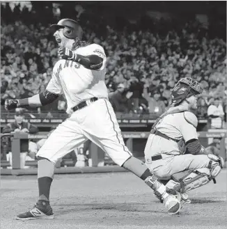  ?? Jeff Chiu Associated Press ?? MICHAEL MORSE of the San Francisco Giants crosses the plate in front of Dodgers catcher Yasmani Grandal after hitting a home run in the eighth inning. The Giants won 4-3 in 10 innings.