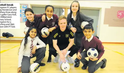  ??  ?? Football break Livingston FC players Craig Henderson and Matthew Knox along with gaffer Gary Holt, visit Williamsto­n Primary School, Livingston for a coaching and Q&amp;A session with P7 kids