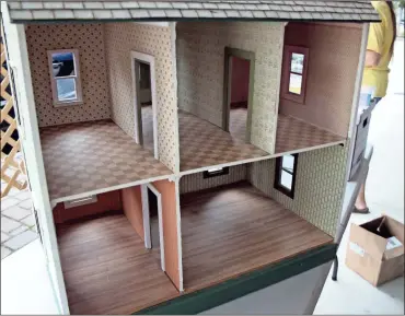  ?? / Kevin Myrick ?? Miniature interior rooms that feature wallpaper are some of the hardest to restore according to Dia Crissey-Baum, who is helping to organize a miniatures club in Polk County.